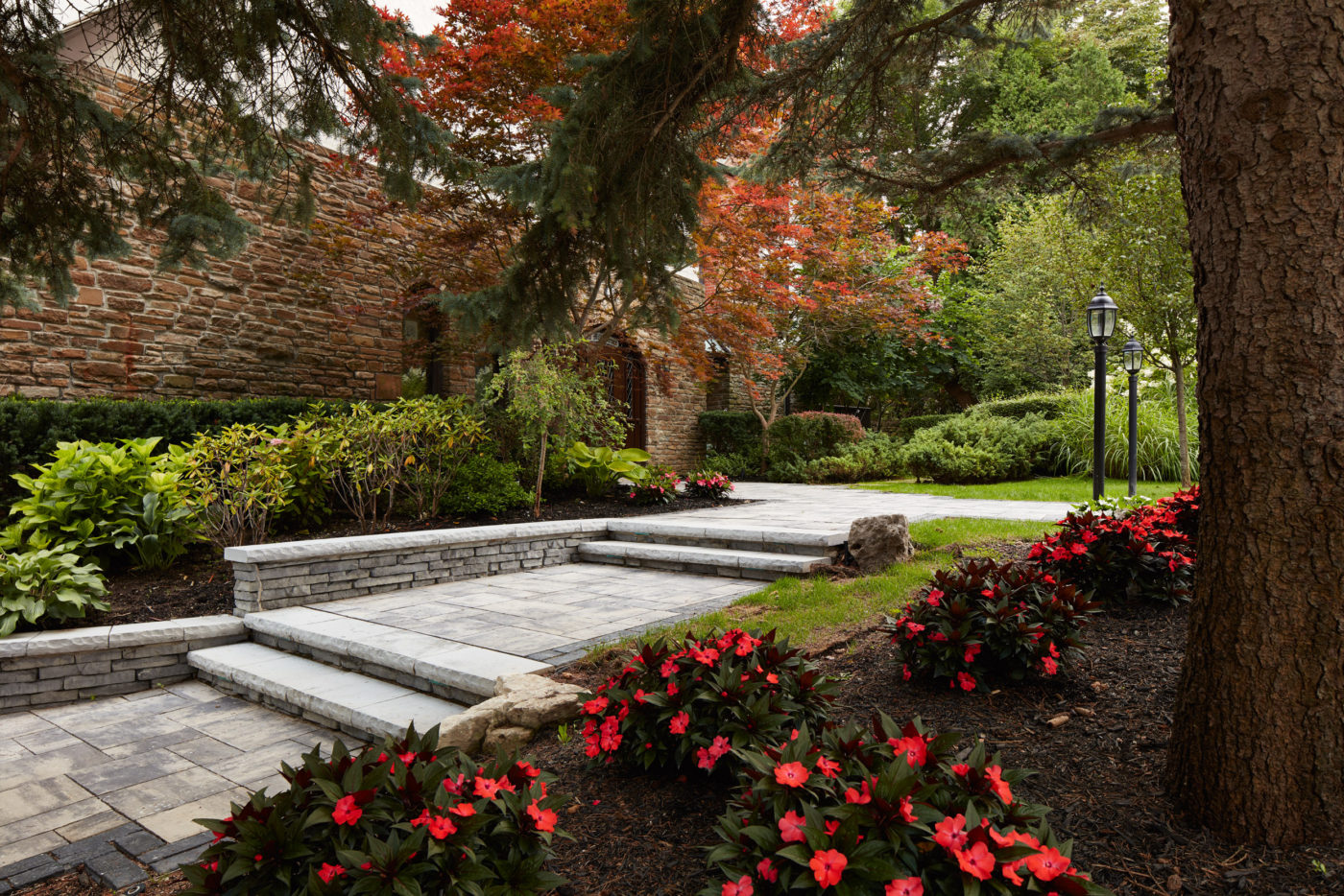 This angle showcases the individual garden beds that make up the front entryway of this property. 