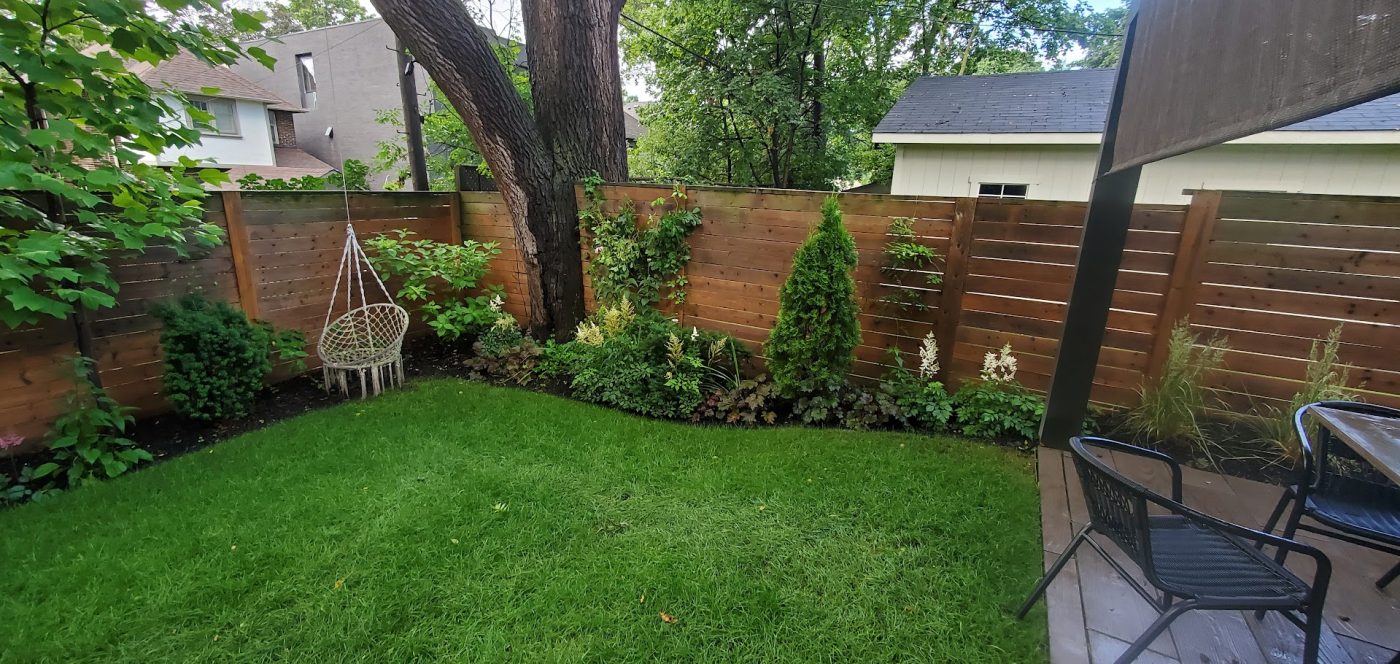 Backyard view showcasing custom built deck and view