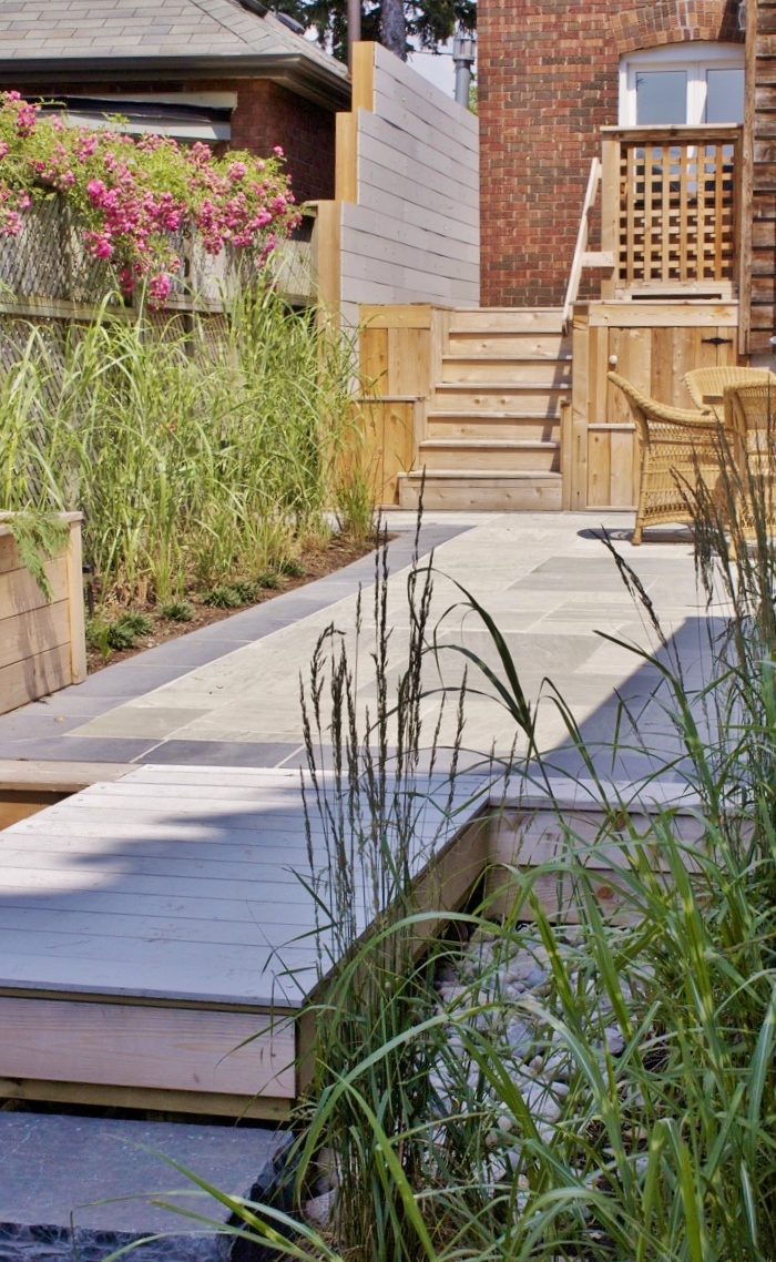 Stone pathway and tall grasses great to prevent flooding
