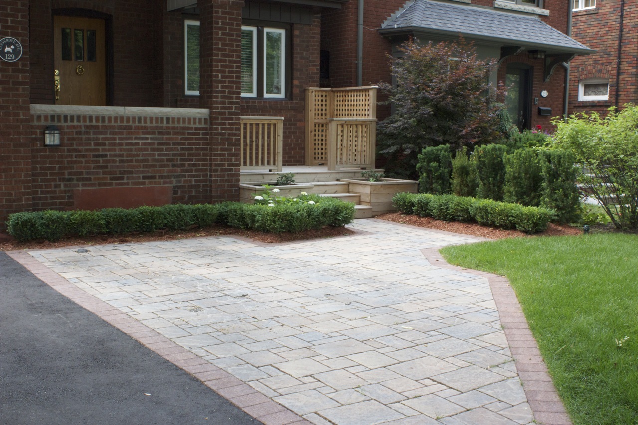 Front entrance with interlock stonework leading up to home entryway