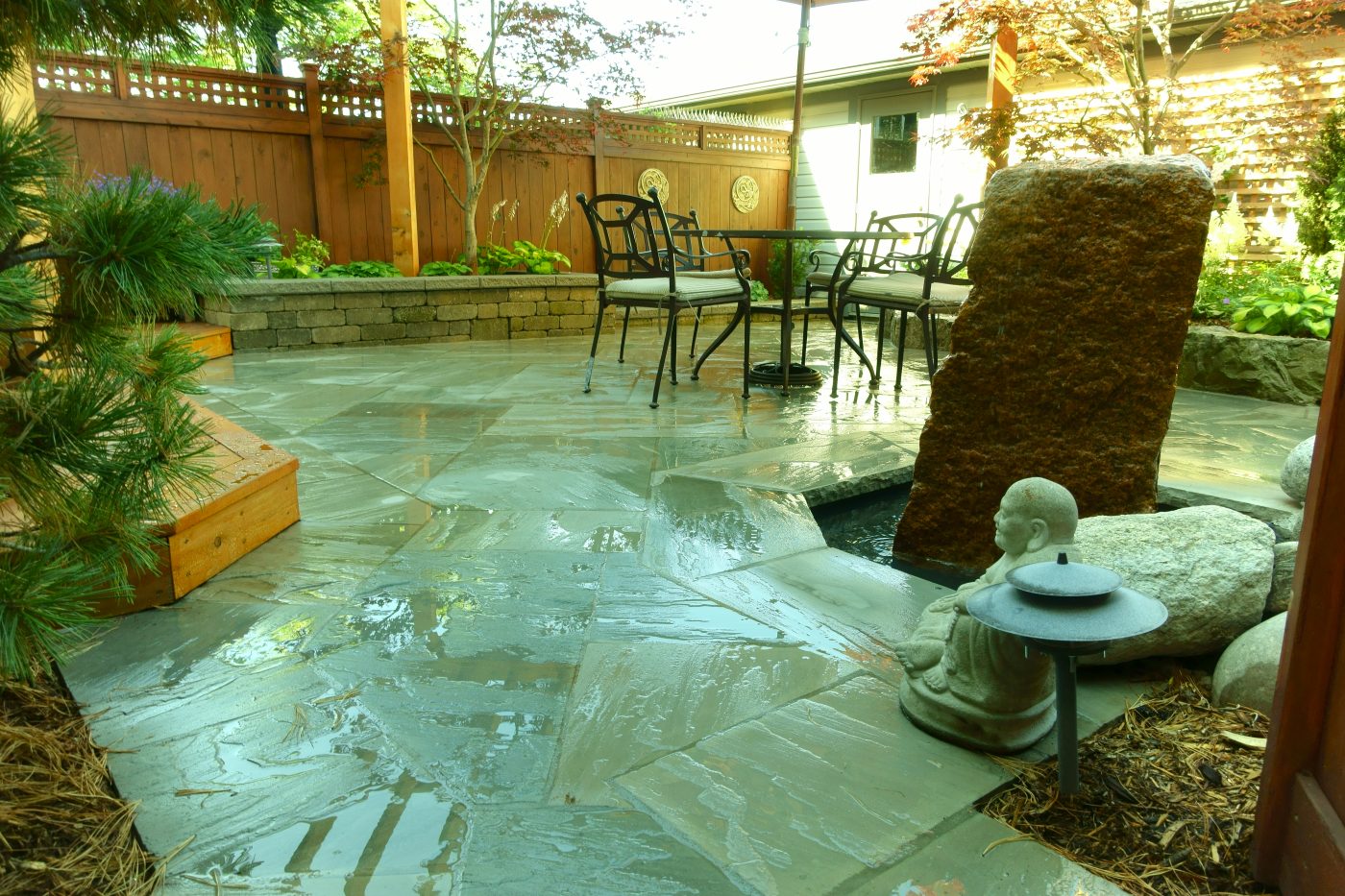water on fresh stone create visually stunning backyard