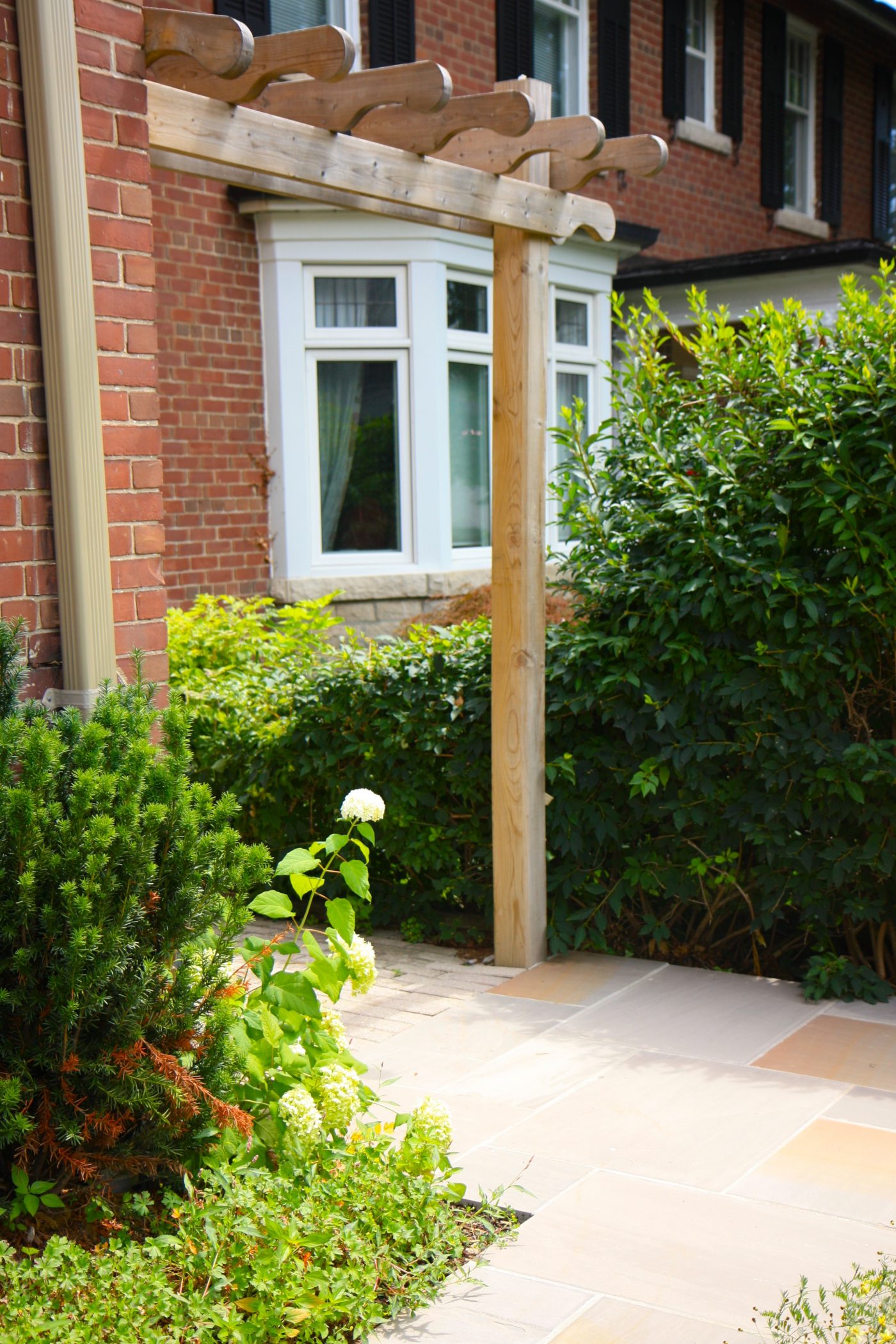 Pergola and stone slab pathway
