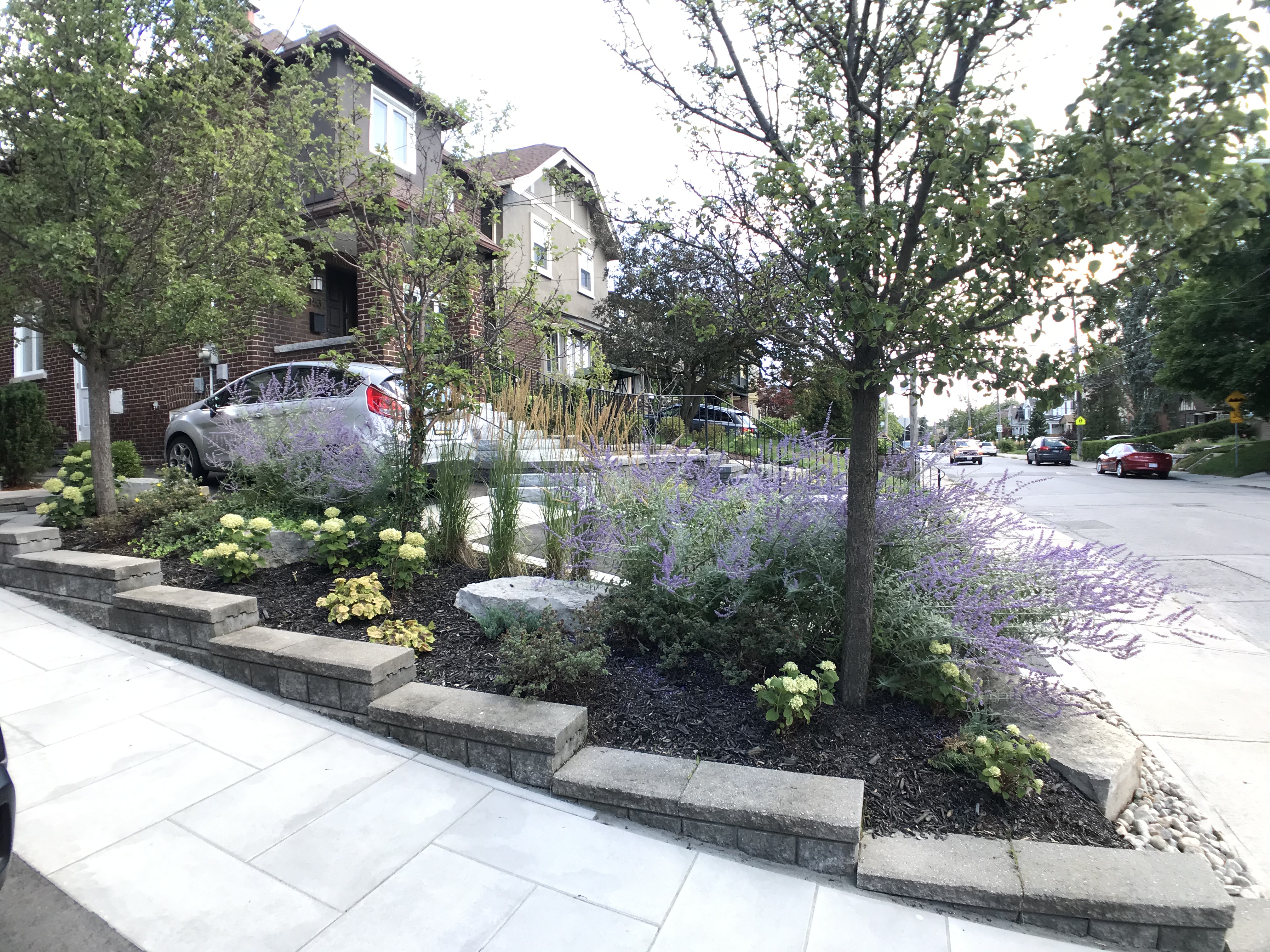 interlock stone slab walkway next to garden