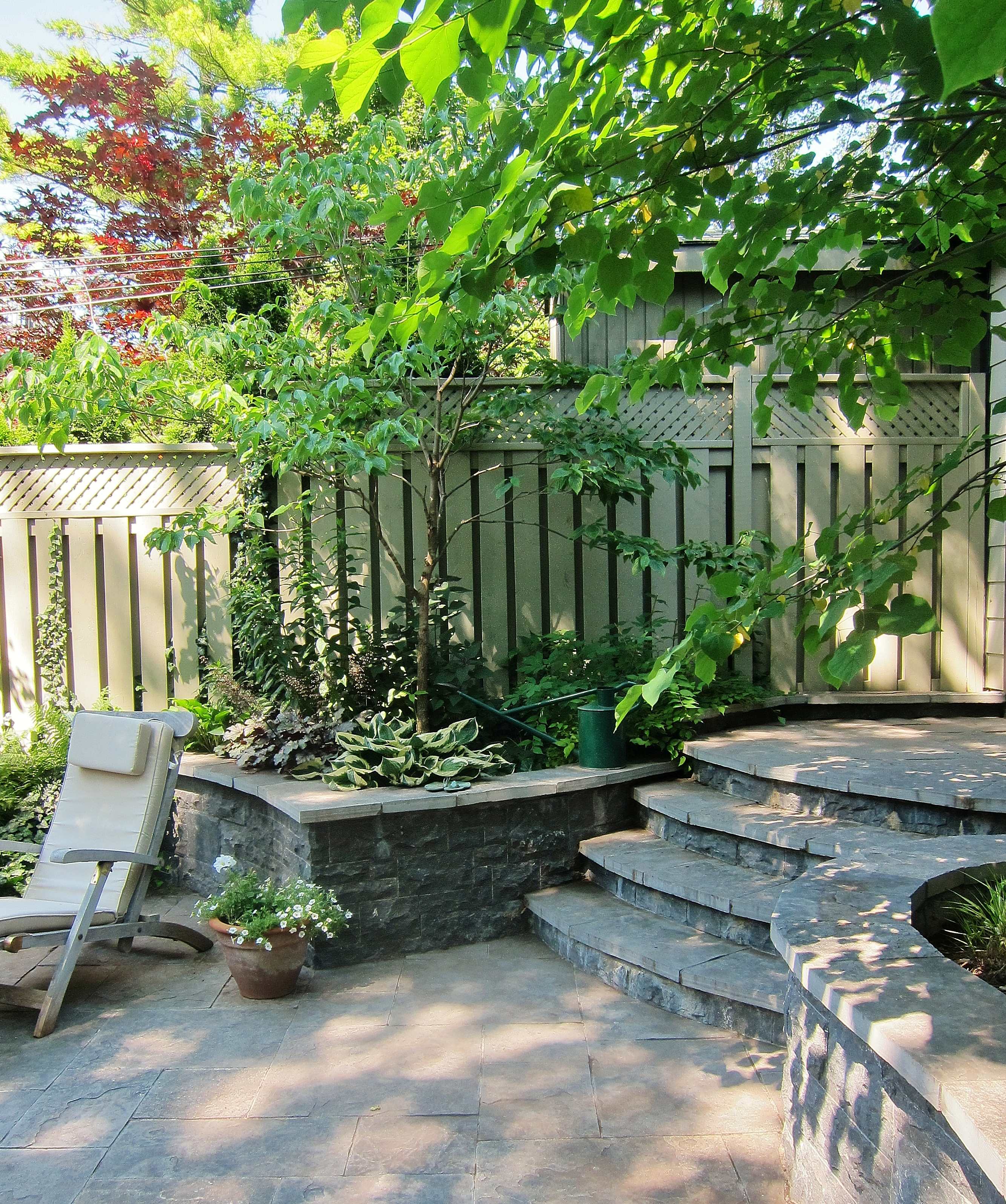 rounded stone staircase with retaining wall along the sides
