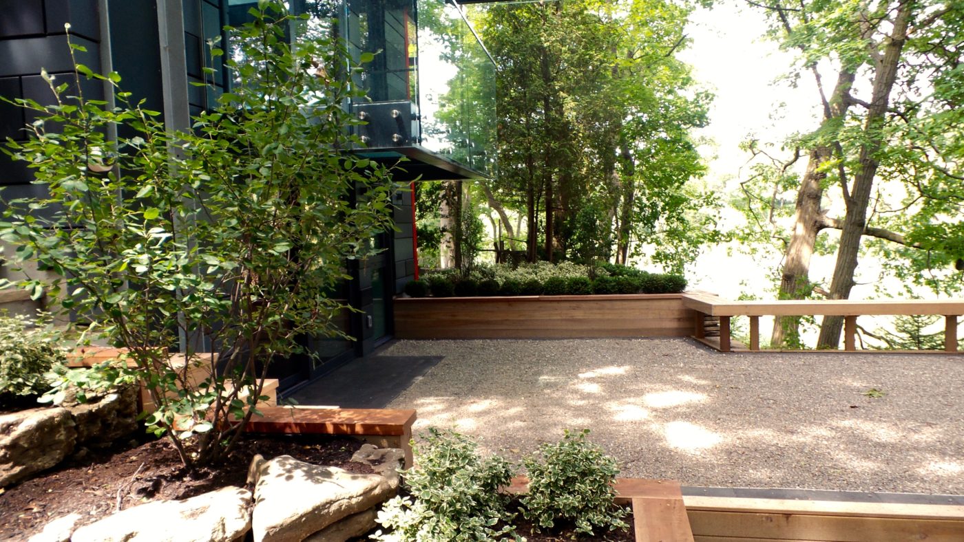 Outdoor Gravel deck with wood railing