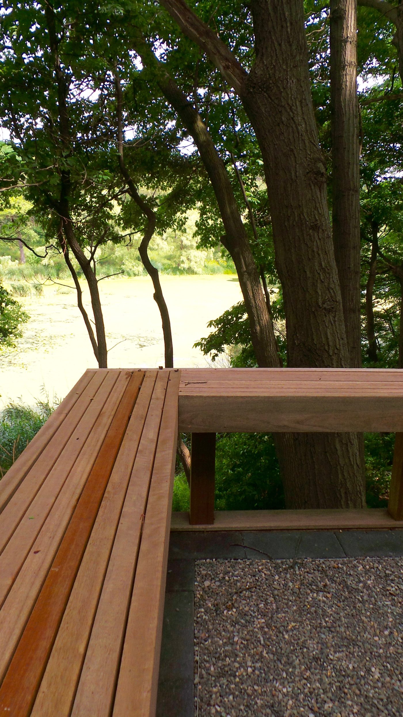Wood seating and railing on stone lined deck