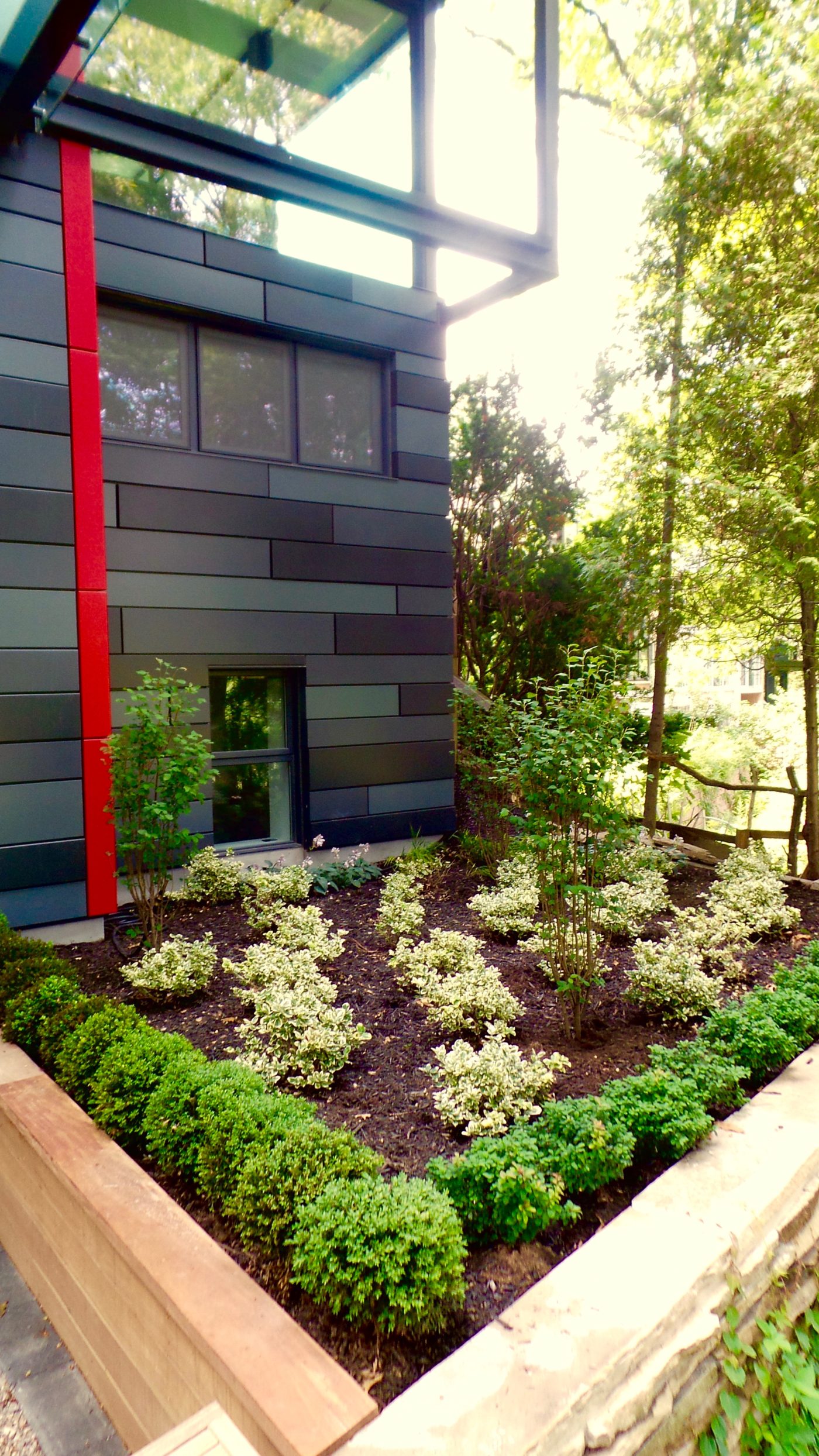 Garden bed with wood railing around Perennials