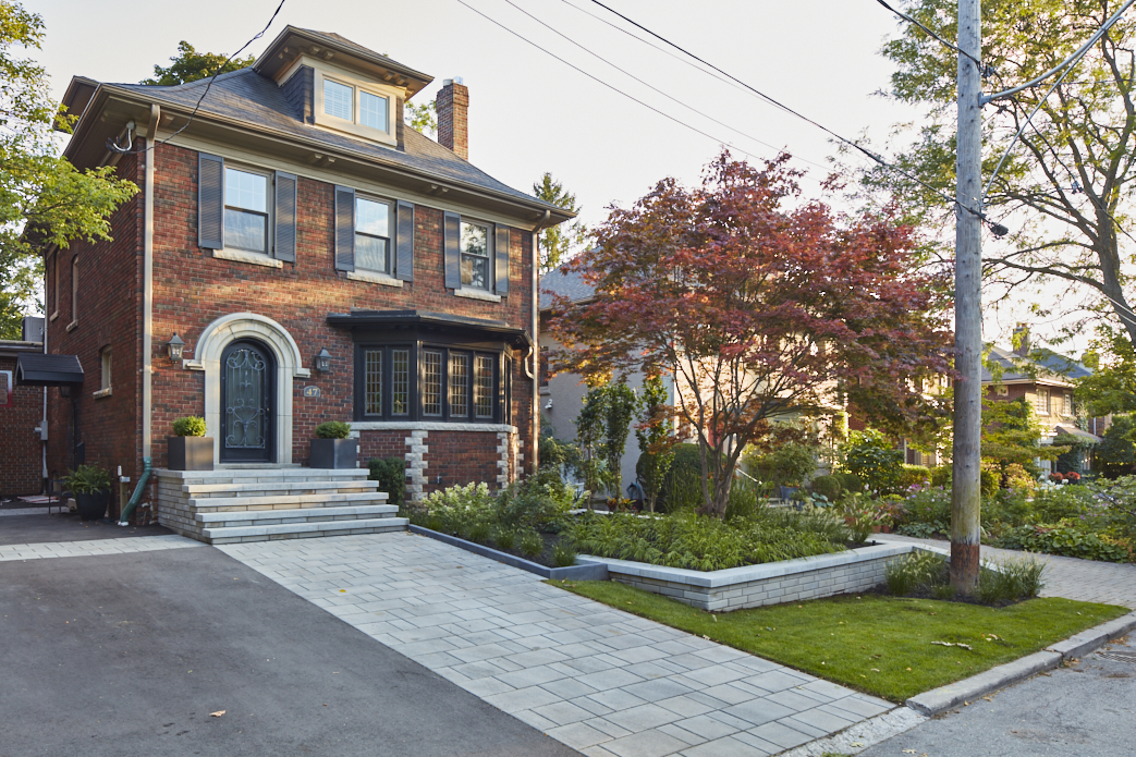 Stone Walkway leads up to matching stone retaining wall and garden beds