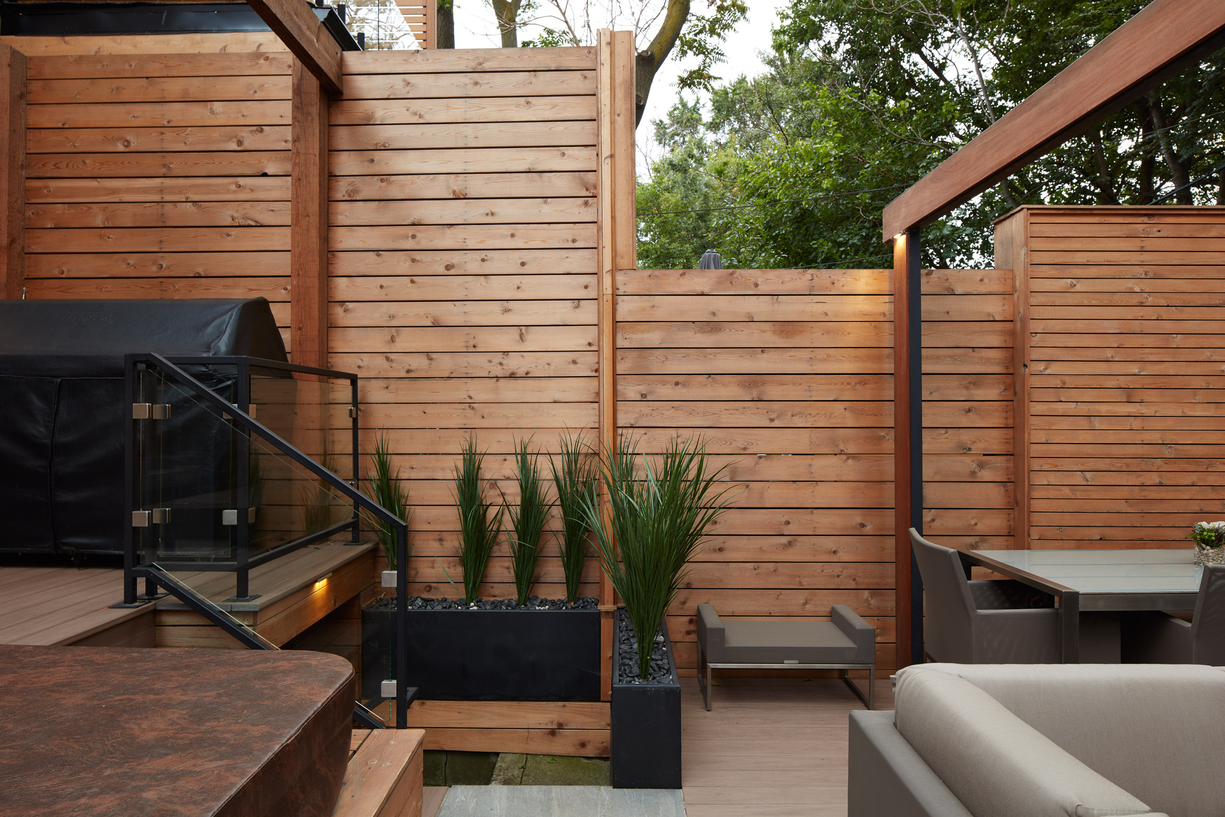 Beautiful multi level fence work that drops lower as you enter the backyard area