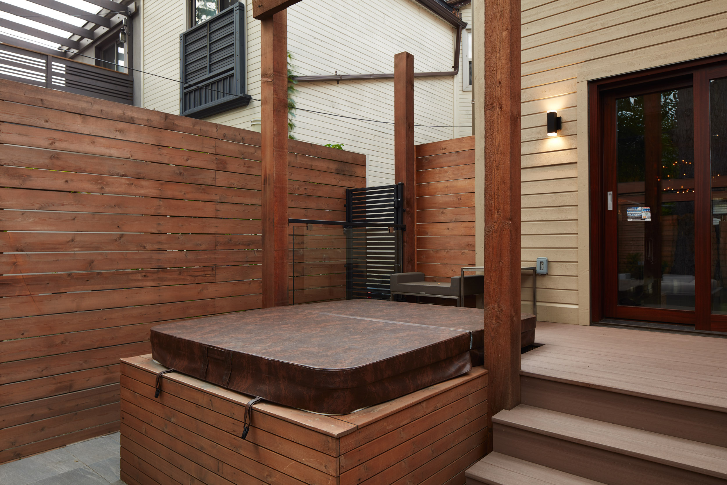 Hot Tub Built into back deck with fence providing ample privacy