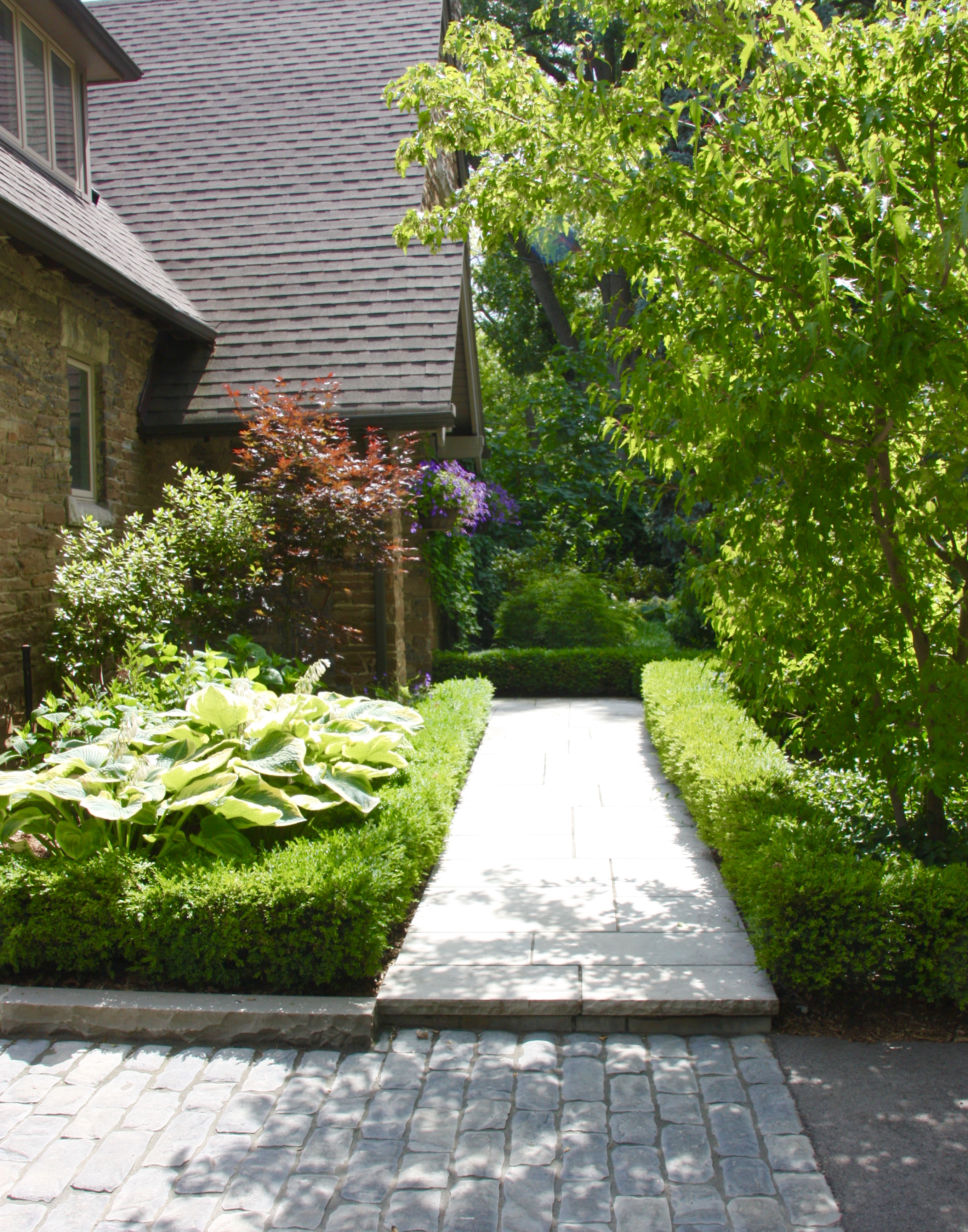 intricate stone work leading up the front door 