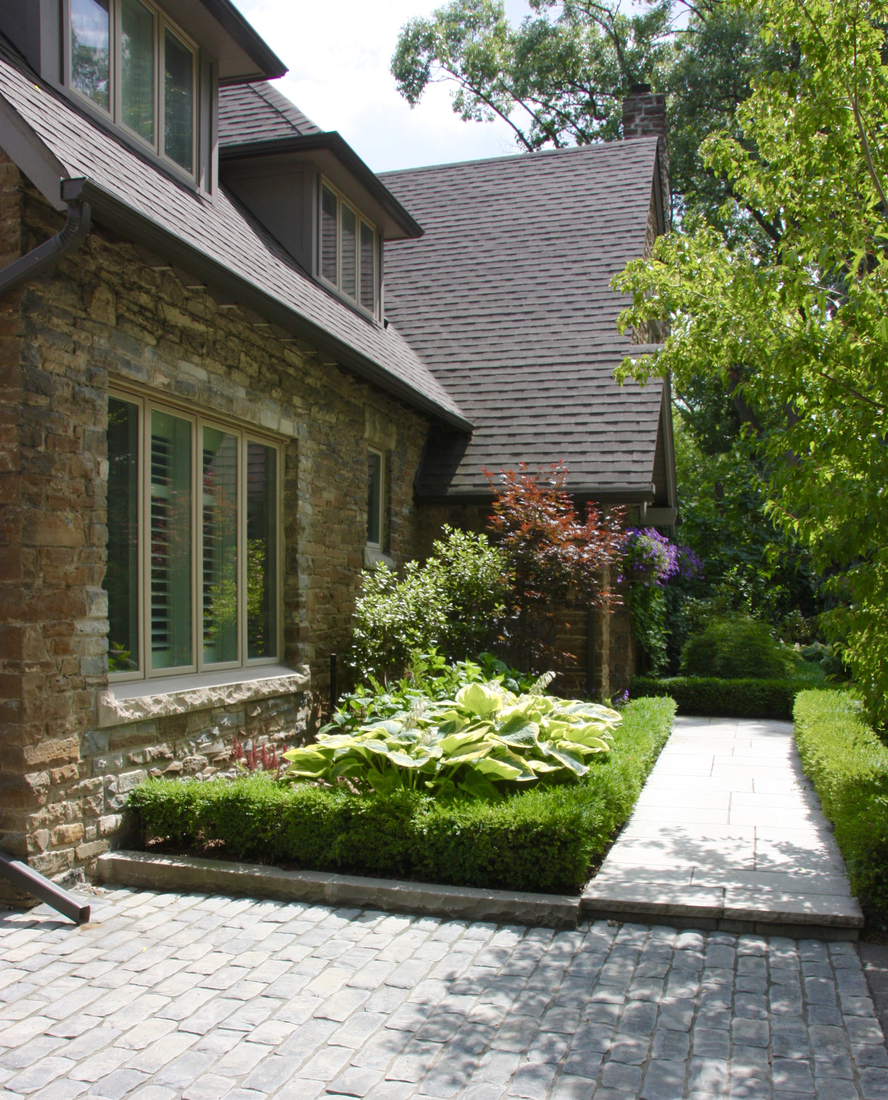 Intricate stonework up to front door separate angle