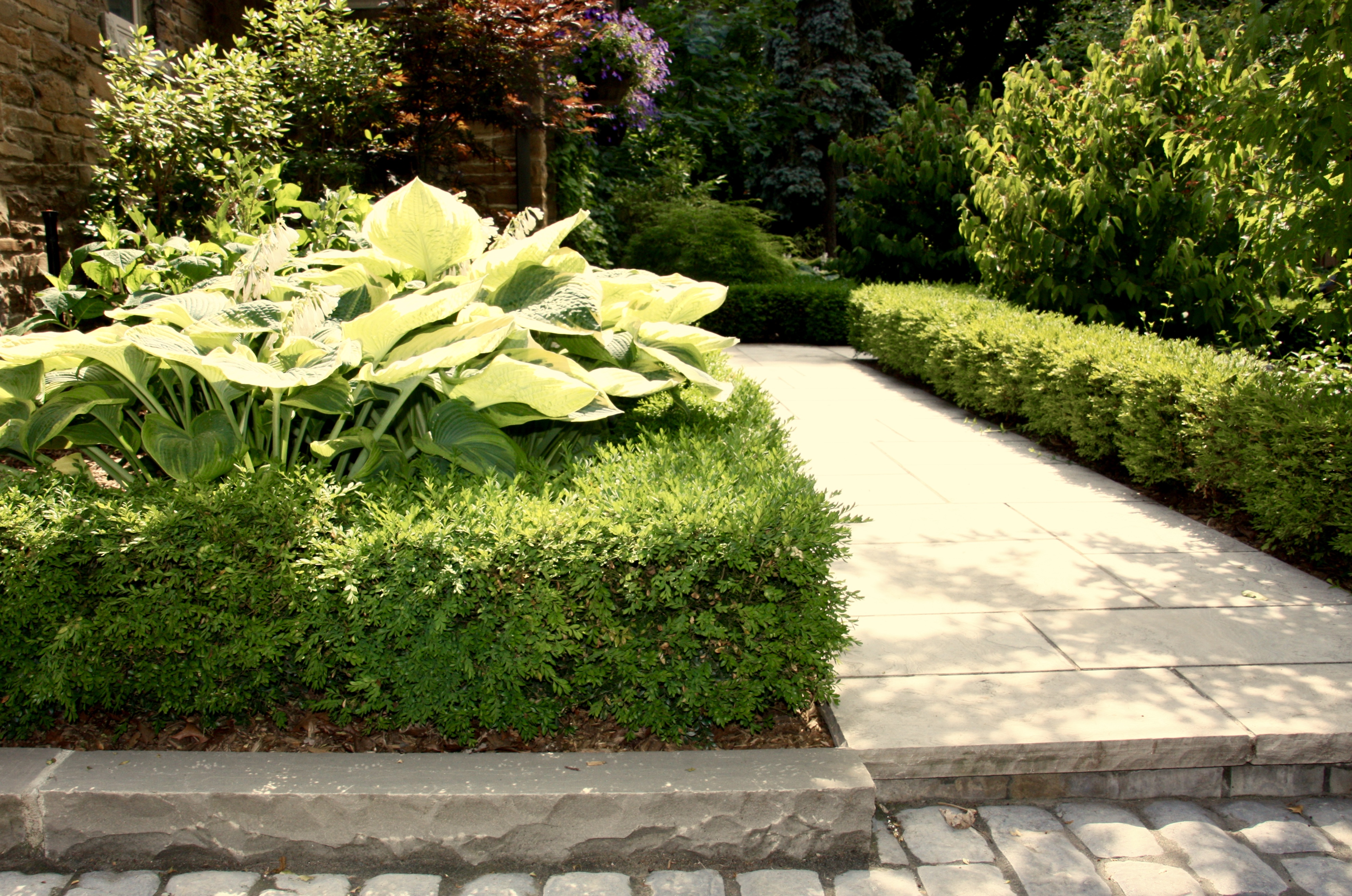 slow lip in stone work providing walking step and different shoveling levels
