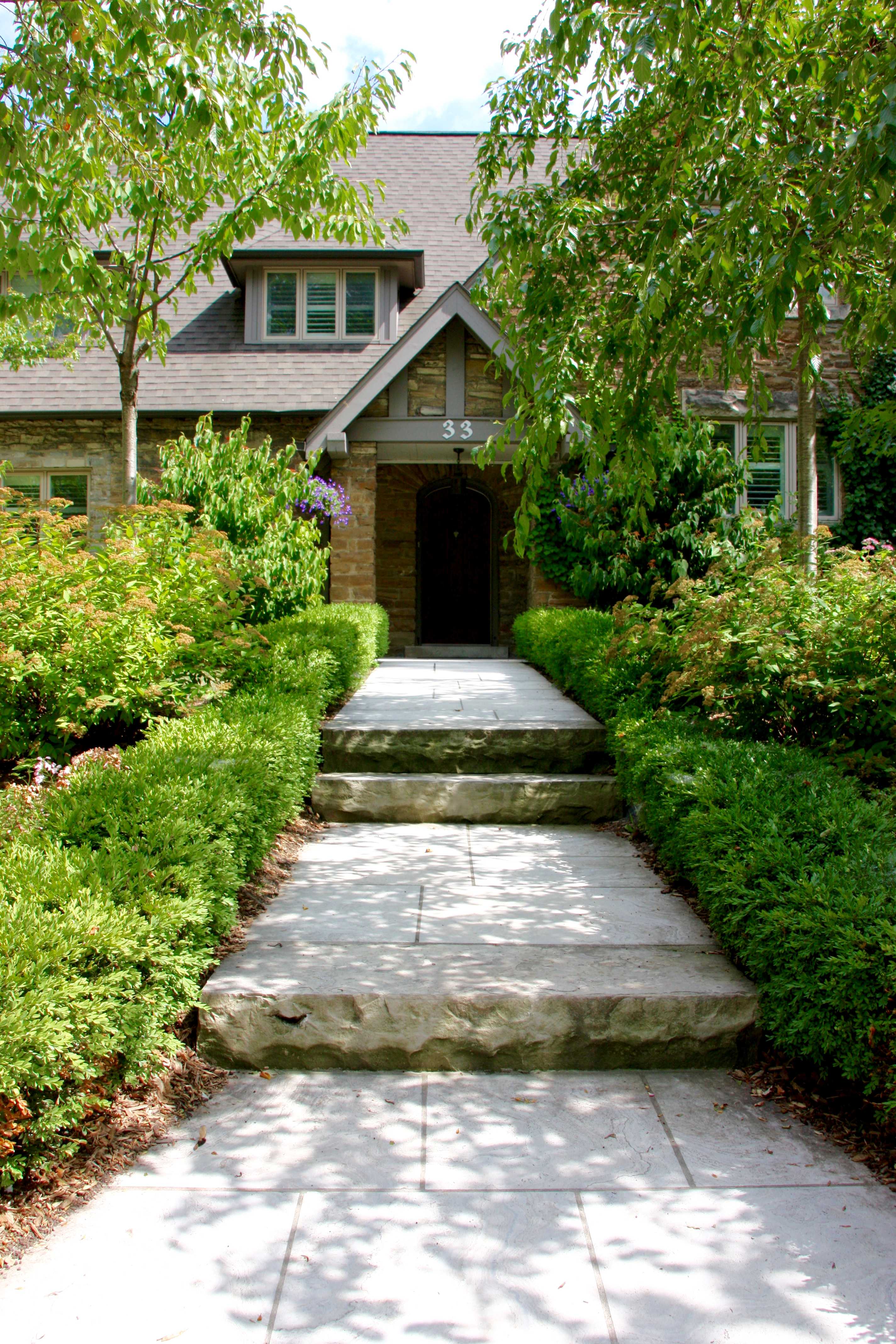 stone walkway with three levels towards front door