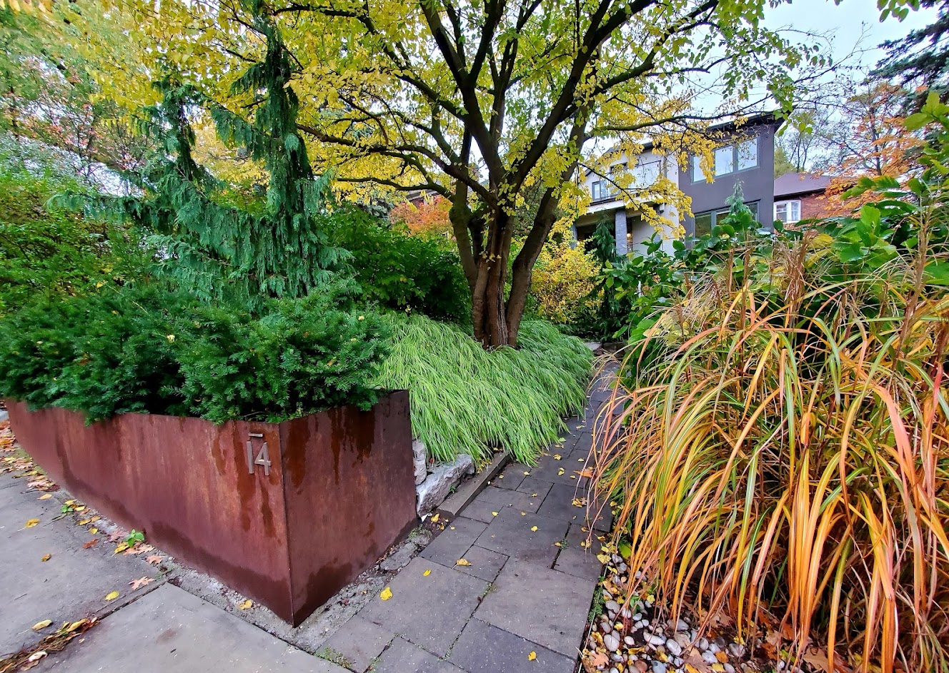 Fall copper planter filled with array of plants