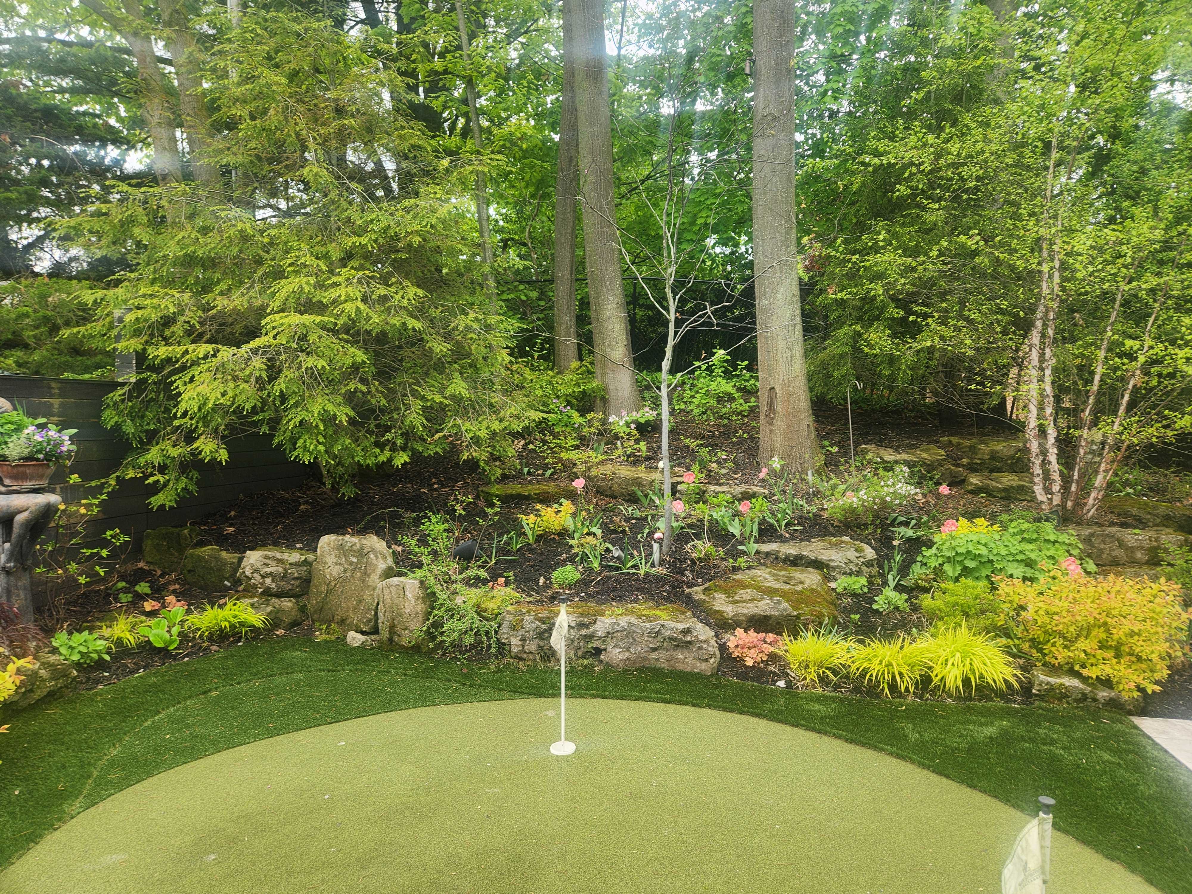 Golf practice green withe beautiful lush Perennial gardens