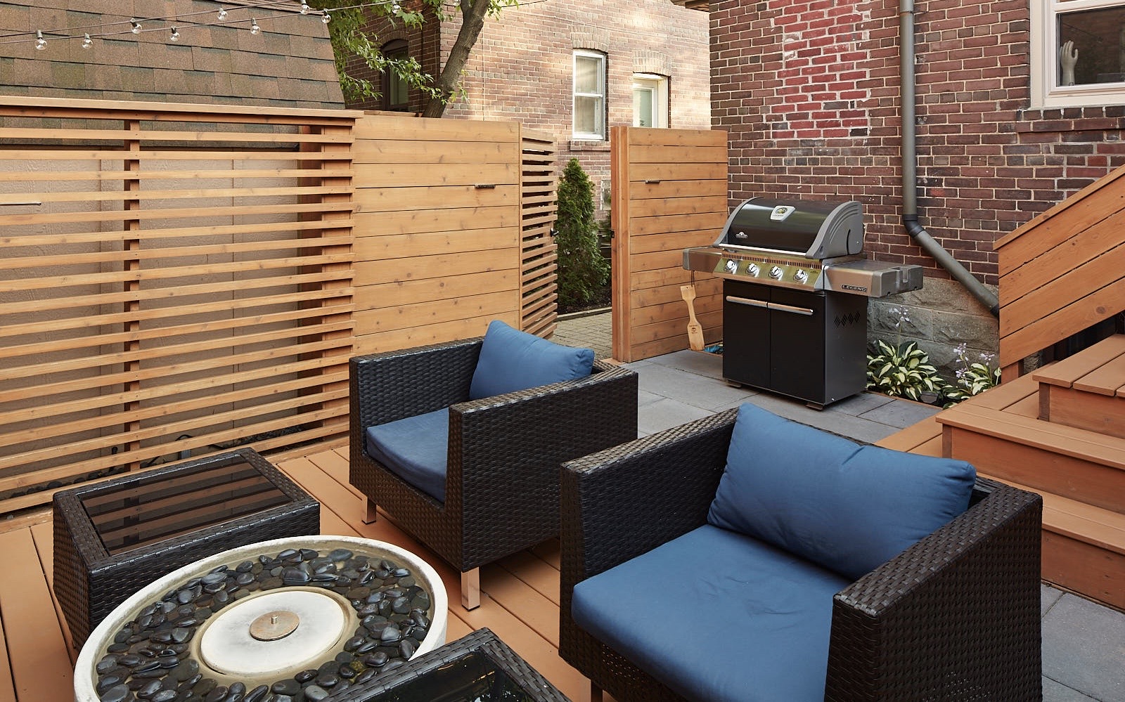 this photo of the backyard showcases the custom build fence and gate