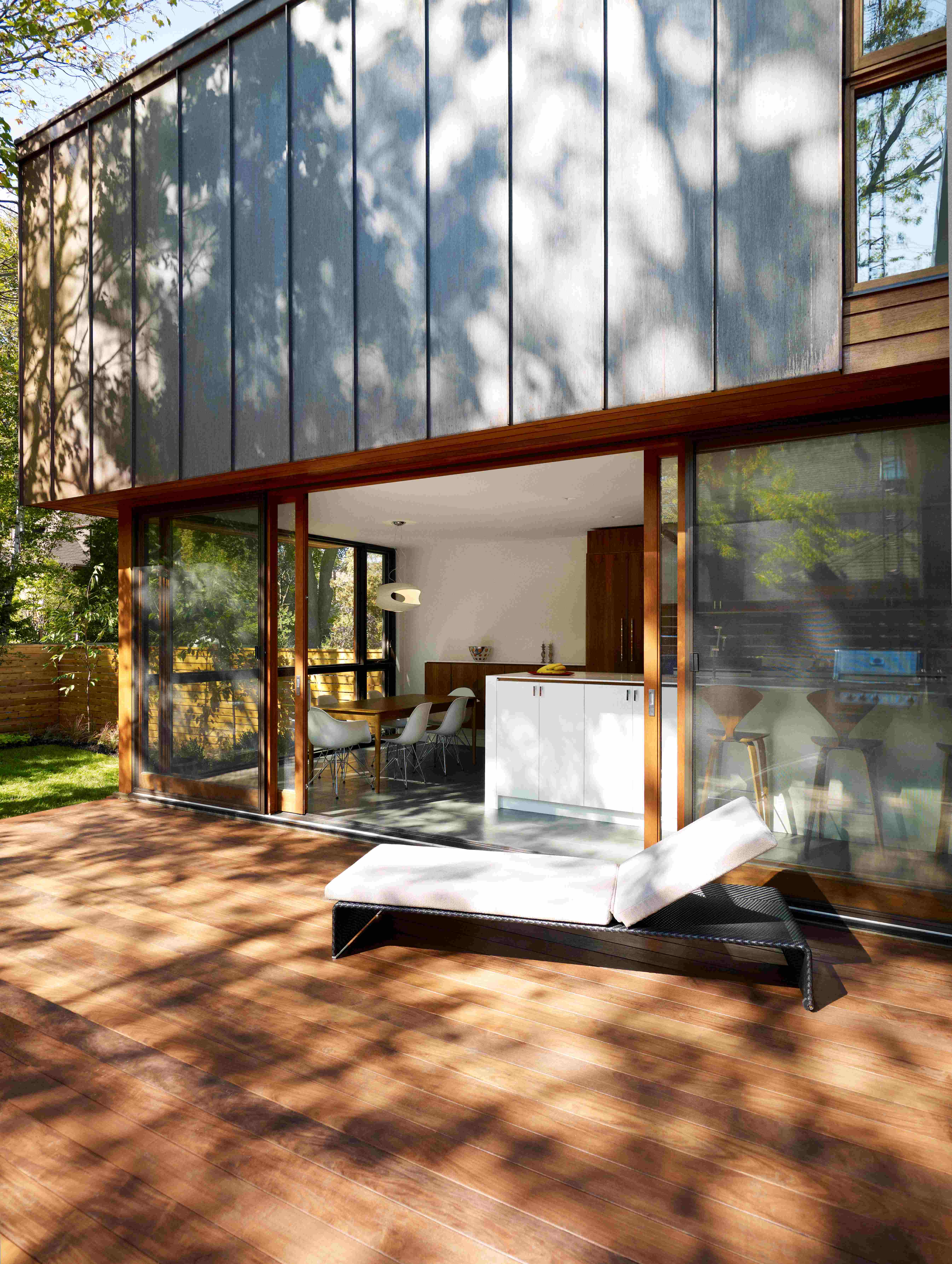 Back deck with sliding glass door and outdoor furniture
