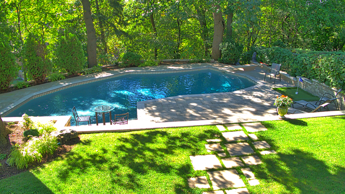 well maintained lawn spaces overlooking large pool