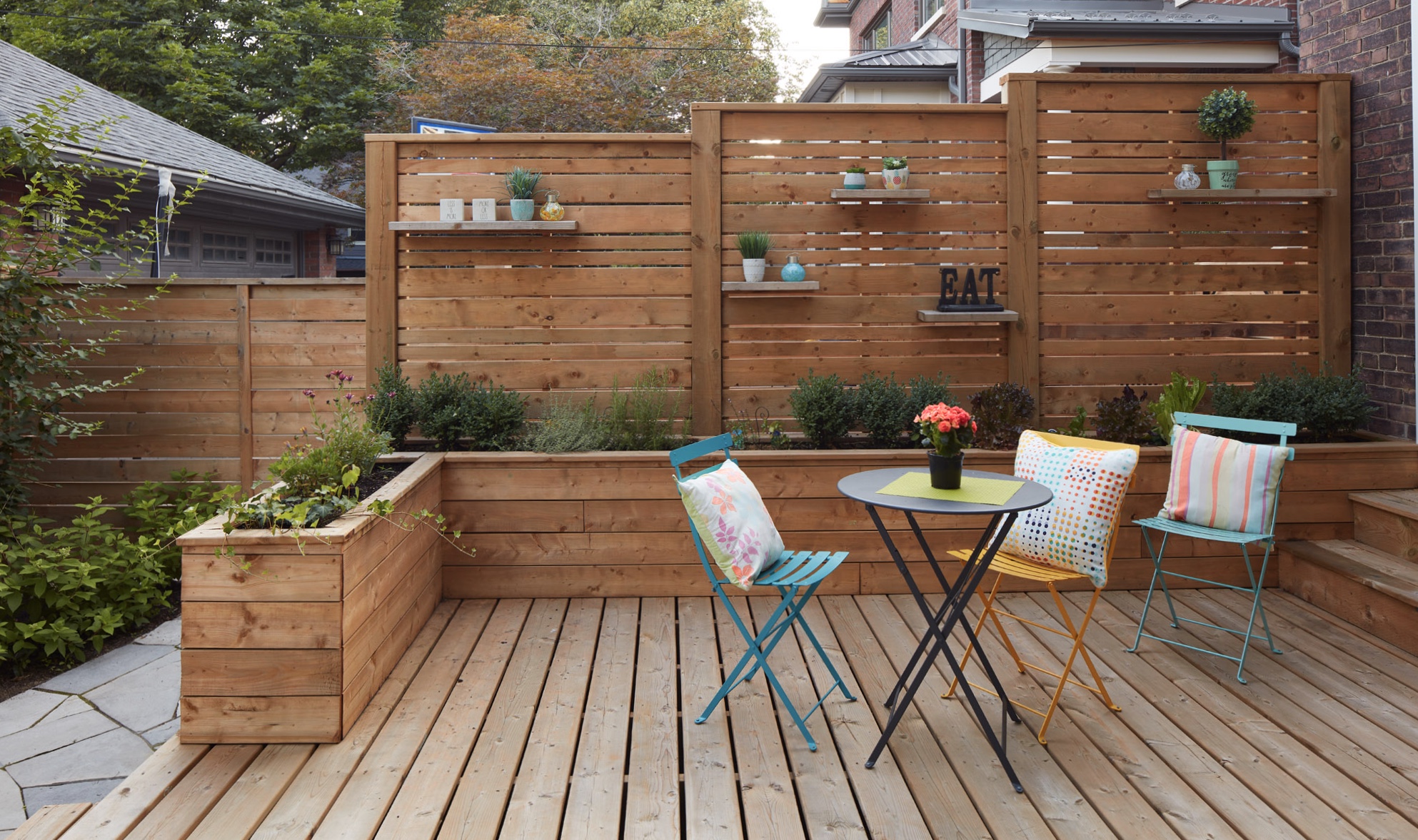 Custom Built fence with retaining wall planter boxes and built in shelves