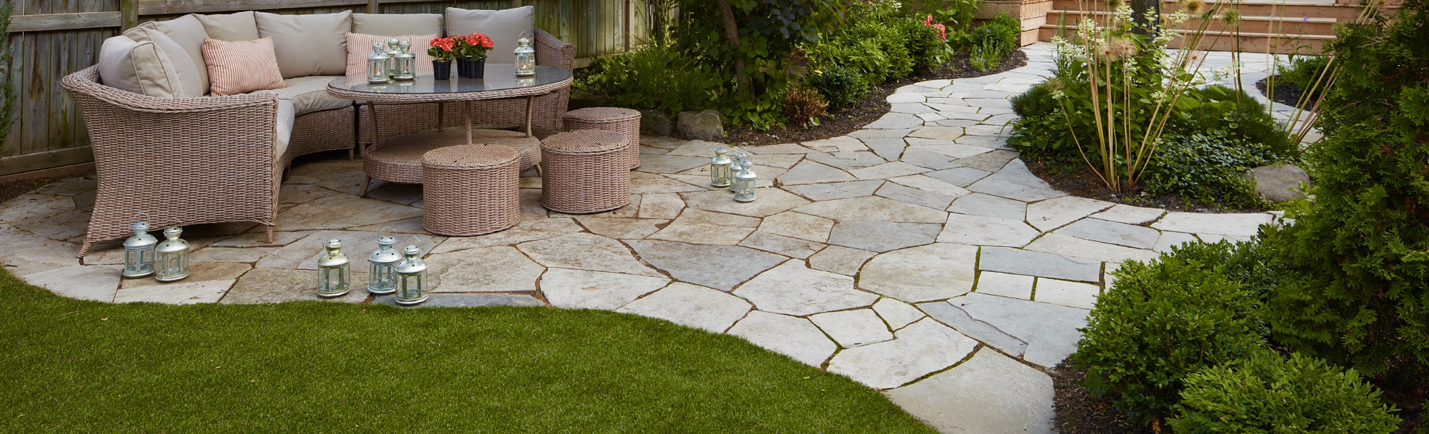 Stone pavers with lawn around the edges