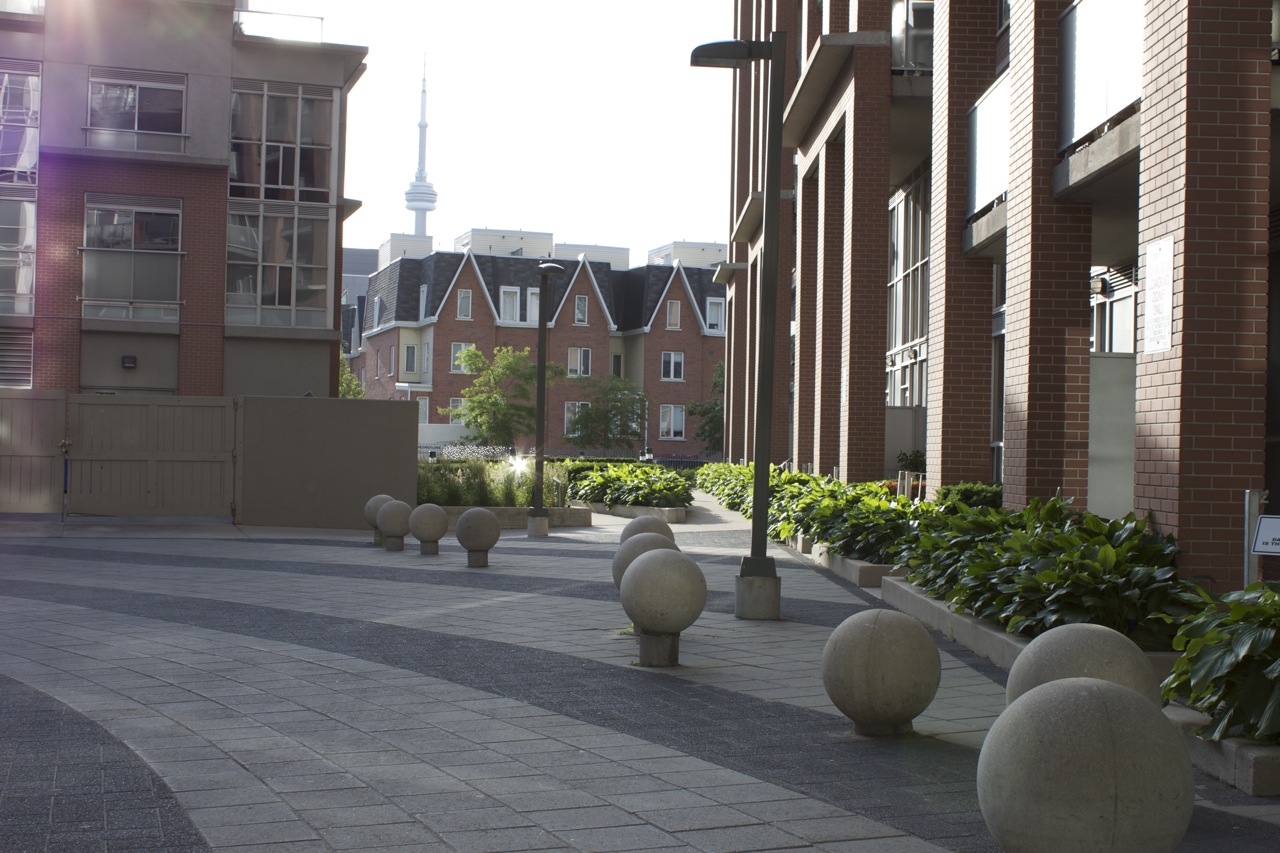 side angle view of building showing of gardens along side decorative stone work