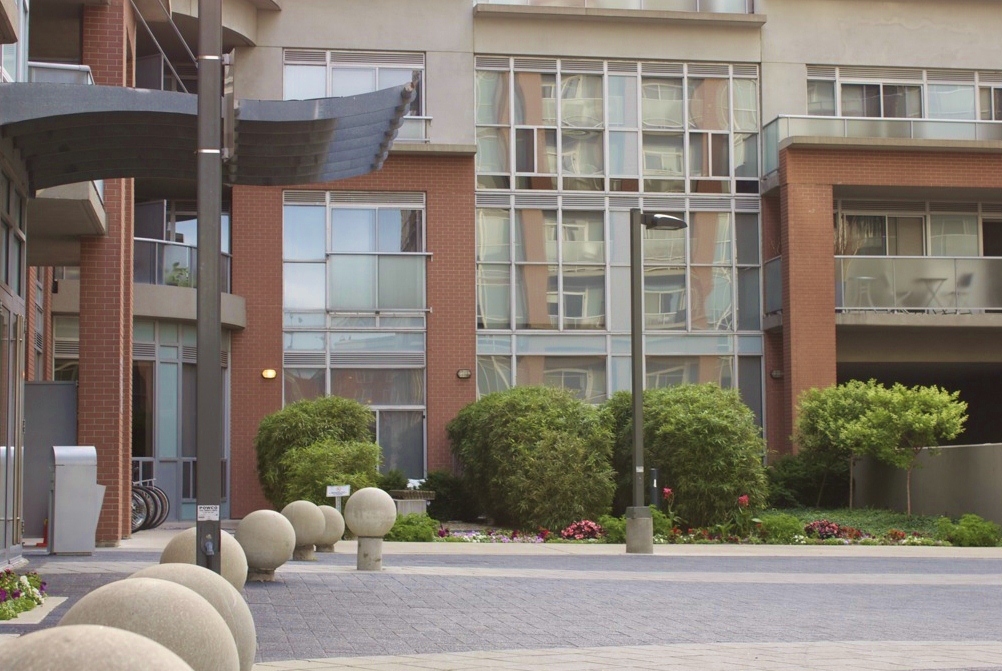 front of property with well trimmed hedges and flower beds
