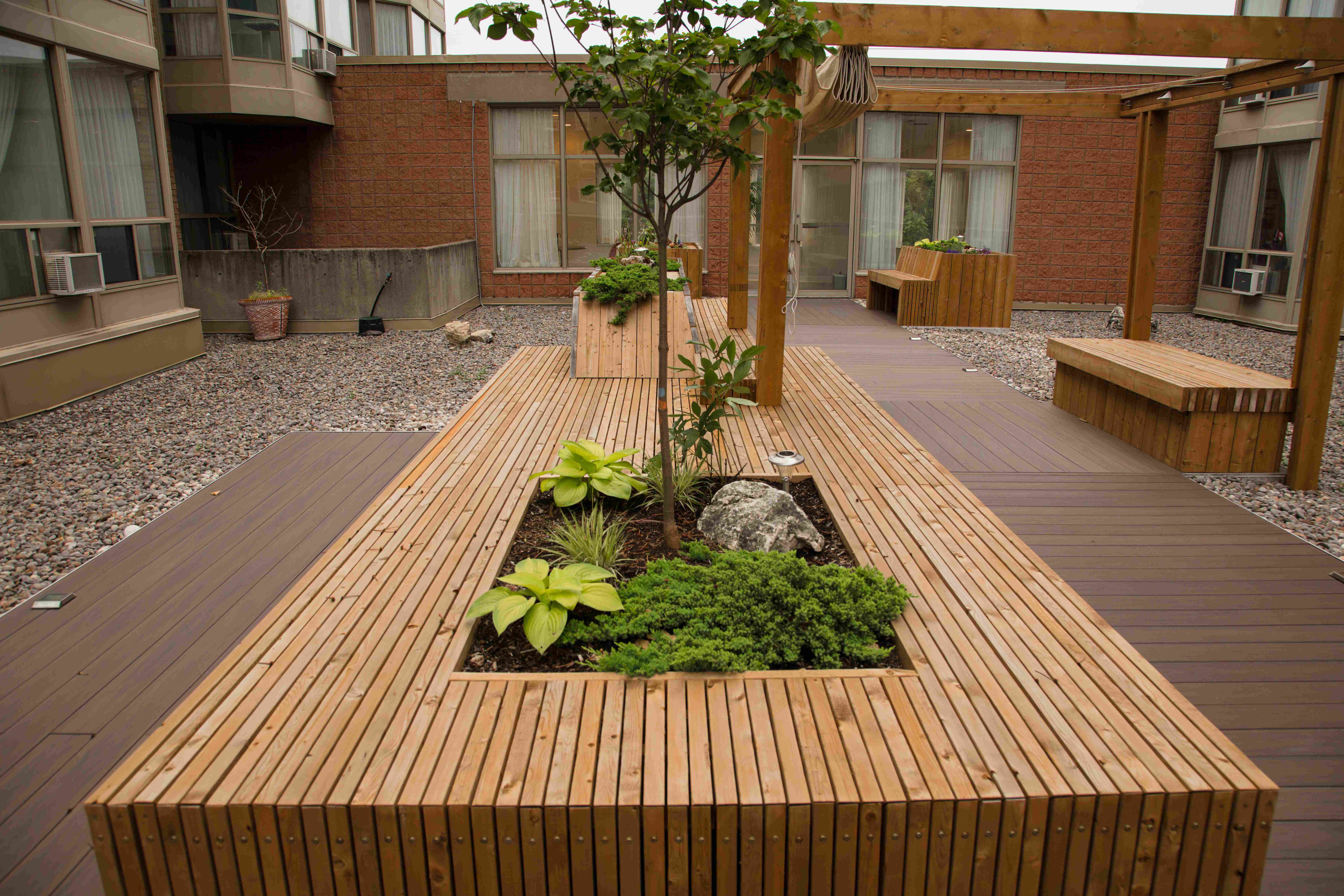 East deck with seating area around planters