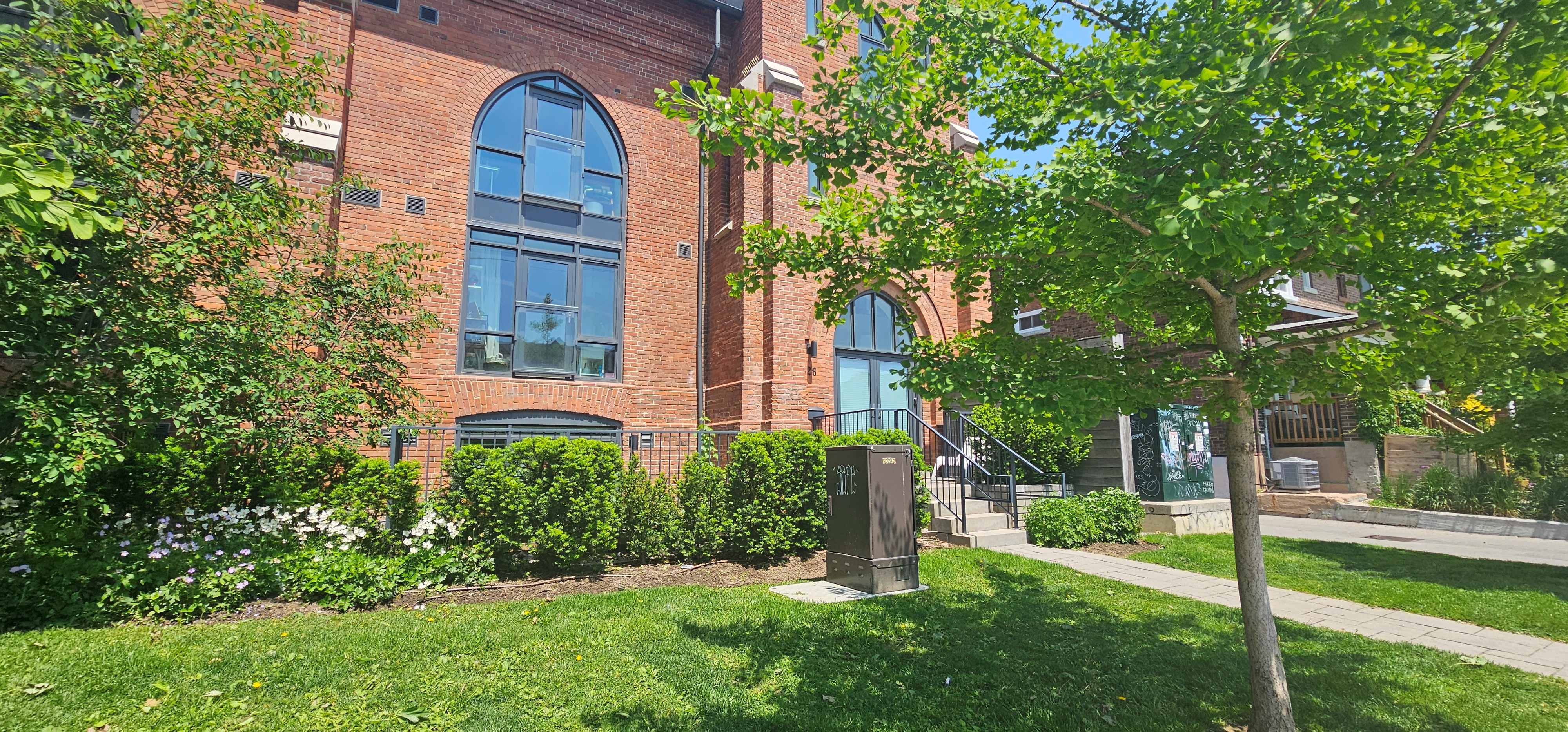 Office property entrance with lawn care, tree care and hedges
