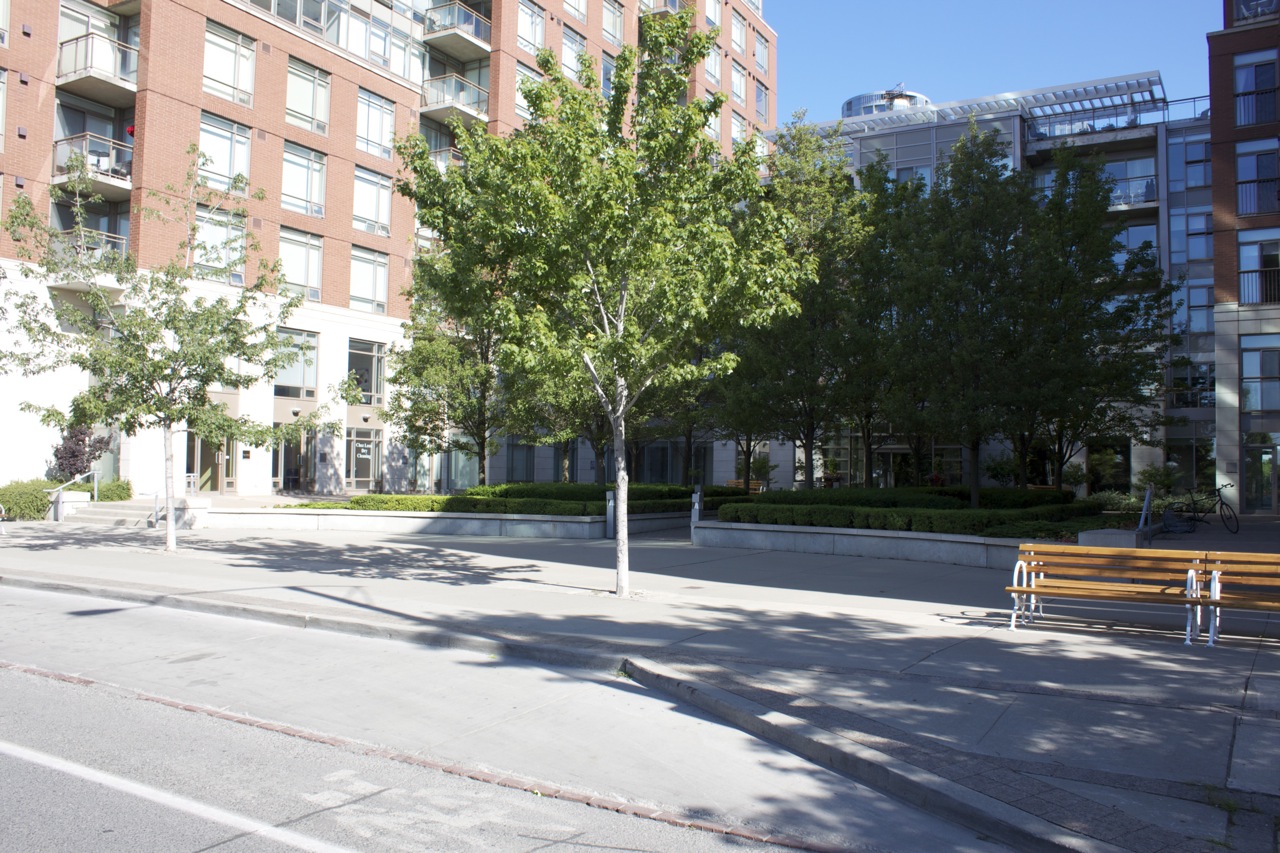 Public benches in the city create places for residents to sit in the well maintained landcare spaces